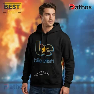 Black hoodie with 'be' in blue/gold, star graphic, 'Billie Eilish' text, & signature on pocket!