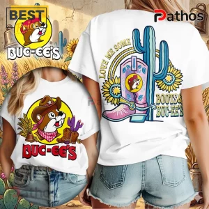 White tee with Buc-ee's beaver, cowboy boots, and cactus graphic! Reads 'Love Me Some Boots & Buc-ee's'!
