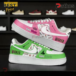 Custom sneakers with Wicked musical theme! Pink Team Glinda shoe and green Team Elphaba shoe with wands and brooms!