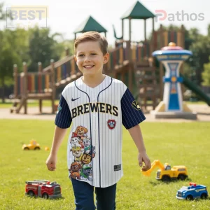 Kids white pinstripe baseball jersey with navy sleeves, yellow BREWERS text, Paw Patrol characters, and a red shield logo!