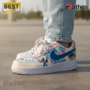 Custom white sneakers with a blue and pink tropical floral print featuring the cartoon character Stitch playing a ukulele!
