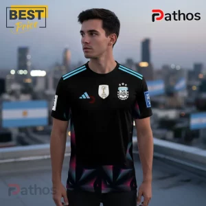 Man in a black Argentina AFA soccer jersey with light blue stripes, three stars crest, and a geometric pattern at the bottom!