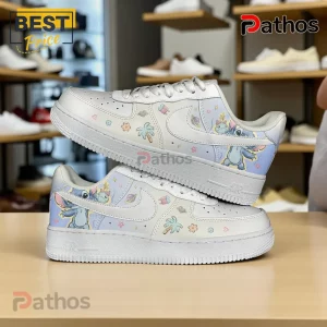 Custom white sneakers with pastel blue Stitch and Scrump character art, palm trees, and planets!