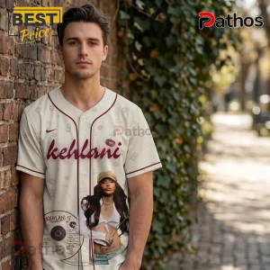 Kehlani World Tour 2026 Limited Edition White Baseball Jersey 3 Cream baseball jersey with maroon stripes featuring Kehlani text and singer photo with kiss marks and retro pattern!