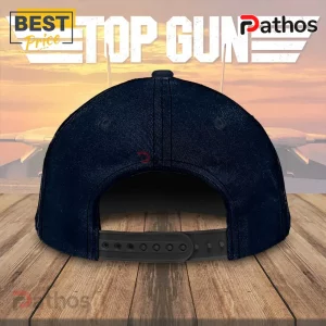 Top Gun 40th Anniversary Tom Cruise 1986-2026 Memorial Baseball Cap 4 Dark navy blue adjustable snapback baseball cap on wooden surface against a Top Gun themed sunset background!