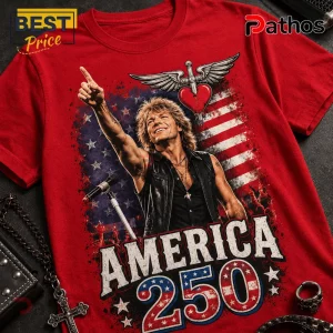 Bon Jovi America 250 Years Of Freedom Patriotic Red Graphic T-Shirt 2 Red t-shirt with rockstar graphic American flag backdrop heart and sword icon and text AMERICA 250 in vintage font!