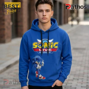 Sonic Live In Concert 2026 35th Anniversary Tour Pullover Hoodie 1 Blue hoodie with Sonic the Hedgehog Live in Concert graphic featuring Sonic using a phone and yellow Sonic logo!