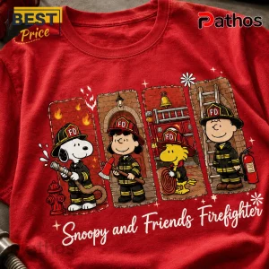 Peanuts Snoopy and Friends Fire Department Red Graphic T-Shirt 1 Red graphic tee featuring Snoopy, Lucy, Woodstock, and Charlie Brown in firefighter gear with Snoopy and Friends Firefighter text!