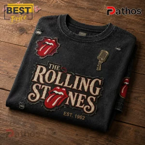 Vintage black acid wash t-shirt featuring The Rolling Stones tongue logo, microphone icon, and text Est 1962!