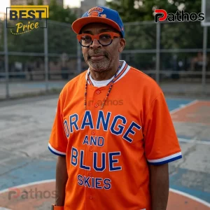 Man wearing orange button-up jersey with text Orange And Blue Skies on a basketball court!