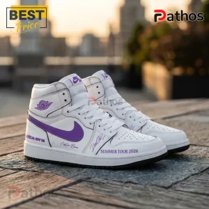 Rita Ora Summer Tour 2026 Limited Edition Air Jordan 1 Sneakers 2 White leather high top sneakers with purple accents and Rita Ora Summer Tour 2026 text on a city rooftop background!