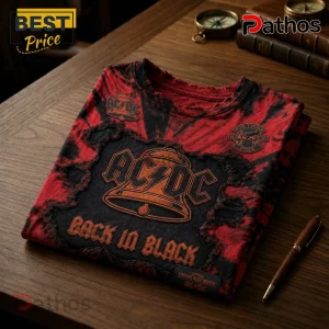 Red and black tie-dye AC DC t-shirt with bell graphic and Back in Black text on a wooden table!