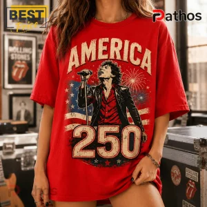 Red oversized vintage t-shirt featuring a rock star graphic, USA flag, fireworks, and the text America 250!