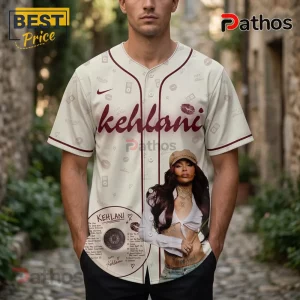 Kehlani World Tour 2026 Limited Edition White Baseball Jersey 1 Off-white baseball jersey with Kehlani photo graphic and maroon lettering featuring lip prints and music icons!