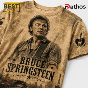 Bruce Springsteen Rock and Roll Never Forgets Timeless T-Shirt 5 Bruce Springsteen graphic t-shirt in beige with a vintage textured finish, featuring his portrait and a guitar logo.!