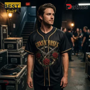 Man wearing black Guns N' Roses baseball jersey with gold trim, vintage revolver and red rose graphic on front.!