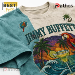 Jimmy Buffett graphic t-shirt featuring tropical parrot, palm trees, and margarita glass on a teal and cream fabric.!