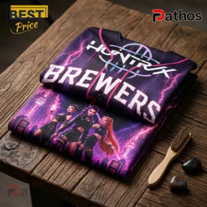 KPop Demon Hunters Milwaukee Brewers 2026 Edition Jersey 1 Folded custom baseball jersey with Huntryx Brewers text, purple lightning, and anime character graphics on wooden table.!