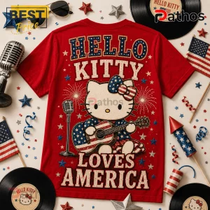 Hello Kitty x America 250 Years of Freedom 1776-2026 Patriotic T-Shirt 2 Red Hello Kitty t-shirt featuring Hello Kitty playing a stars and stripes guitar with fireworks and microphone graphics.!