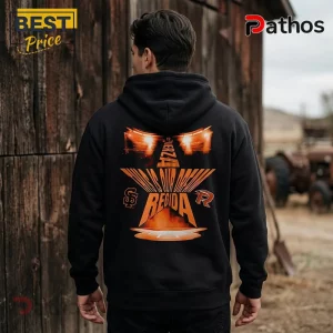 Back view of black cotton hoodie featuring orange graphic text reading FUERZA REGIDA and THIS IS OUR DREAM in a star shape.!