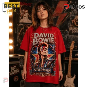 Red cotton crewneck t-shirt featuring a graphic print of David Bowie as Ziggy Stardust with gold and blue cosmic accents.!