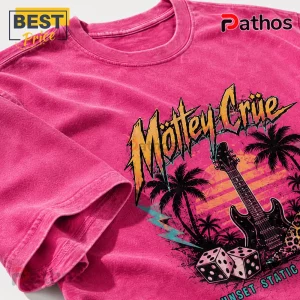 Hot pink mineral-wash cotton t-shirt featuring Mötley Crüe logo, electric guitar, palm trees, dice, and sunset graphic.!