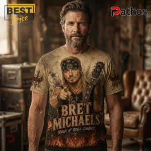 Bret Michaels Rock N Roll Cowboy Retro Casual Apparel T-Shirt 3 Bearded man wearing a tan all-over print t-shirt featuring Bret Michaels with a guitar, bandana, and fire graphics.!