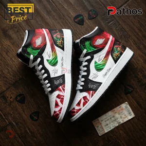 Custom high-top sneakers with red and green flame patterns, black leather overlays, white laces, and rock band graphic art.!