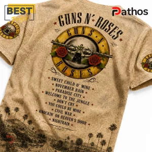 Guns N' Roses band t-shirt in beige featuring a vintage bullet and rose logo, song titles, and a palm tree landscape.!