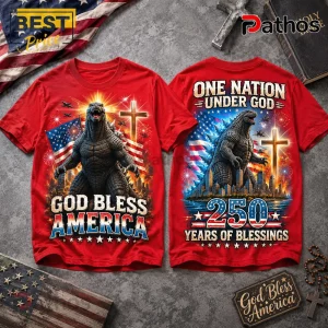 Red graphic t-shirt featuring Godzilla, American flag, Christian cross, and text God Bless America and 250 Years of Blessings.!