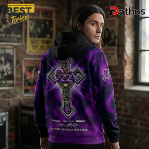 Ozzy Osbourne Signature Tribute 1948-2025 Hoodie 3 Man wearing black hoodie with purple smoke pattern, Ozzy Osbourne cross graphic, dates 1948-2025, and text signature.!