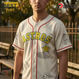 Cream-colored Houston Astros baseball jersey with red piping, yellow text, Toy Story character prints, and sheriff badge.!