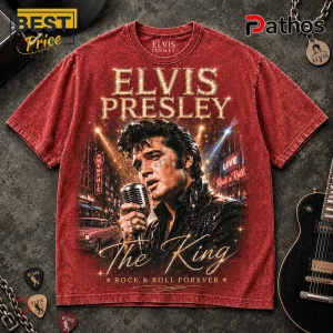 Red cotton crewneck t-shirt featuring a vintage portrait of Elvis Presley holding a microphone with text The King.!