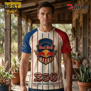 Man wearing a red, white, and blue vintage-style Red Bull graphic t-shirt with 1776 and 250 printed on the fabric.!