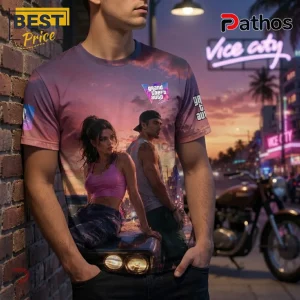 Grand Theft Auto VI graphic t-shirt featuring a sunset cityscape with a man and woman leaning on a car hood.!