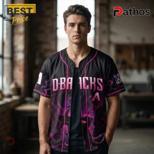 Man wearing a black and pink Diamondbacks baseball jersey with vaporwave patterns and buttons over a black undershirt.!