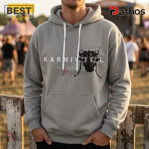 Light grey pullover hoodie featuring black Karnivool band graphic with white drawstring cords against a festival background.!