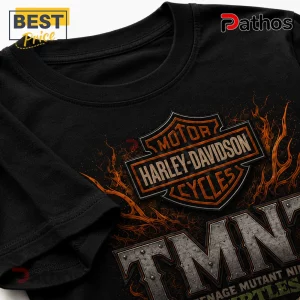 Black cotton t-shirt featuring a Harley-Davidson logo combined with metallic TMNT text and orange flames.!