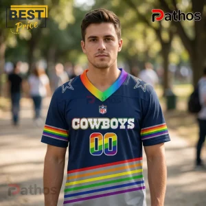 Dallas Cowboys x LGBT Pride Limited Edition Football Jersey 1 Man wearing a navy blue Dallas Cowboys jersey featuring rainbow stripe accents, a rainbow V-neck, and the number 00.!