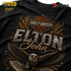 Black cotton t-shirt featuring a Harley-Davidson logo, Elton John text, and a bald eagle wearing sunglasses over piano keys.!