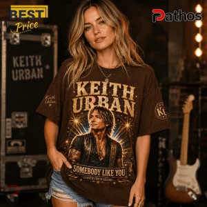 Woman wearing a brown oversized cotton t-shirt with Keith Urban graphic, Somebody Like You text, and country rock print.!