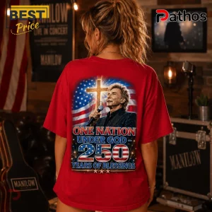 Red t-shirt featuring Barry Manilow holding a microphone before an American flag and golden cross graphic.!