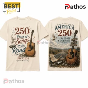 USA 250th Anniversary Heritage Guitar Off-White T-Shirt 4 Beige cotton t-shirt with America 250 anniversary graphic, acoustic guitar, harmonica, and road landscape illustration.!