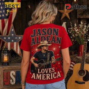 Jason Aldean America 250 Years 1776-2026 Patriotic Concert T-Shirt 5 Red graphic t-shirt featuring Jason Aldean playing guitar, text reading Jason Aldean Loves America, and patriotic motifs.!