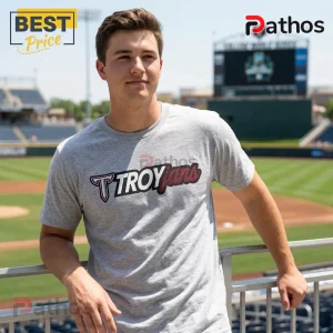 Troy Trojans 2026 College World Series Omaha Bound Shirt 2 Man wearing a heather gray T-shirt with black and red Troy Trojans collegiate logo at a baseball stadium.!