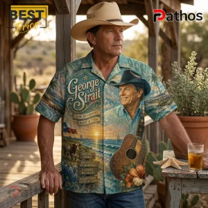 Man wearing a George Strait print button-down shirt with coastal, country, and guitar imagery against a rustic porch background.!