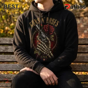Black hooded sweatshirt featuring a Guns N' Roses graphic of a skeleton hand holding a revolver with a red rose.!