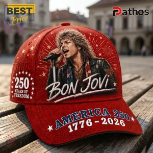 Red baseball cap featuring Jon Bon Jovi, American flag motifs, stars, and text reading America 250 1776-2026.!