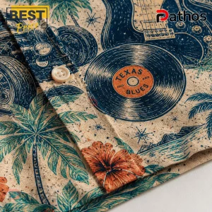 ZZ Top Sharp Dressed Man Tropical Hawaiian Shirt 4 Close-up of a tan linen shirt featuring a blue print of guitars, vinyl records labeled Texas and Blues, and palm trees.!