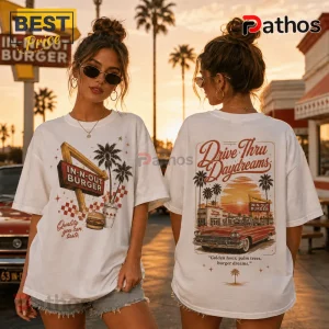 White oversized t-shirt with In-N-Out Burger graphics, red classic car, palm trees, and California sunset imagery.!